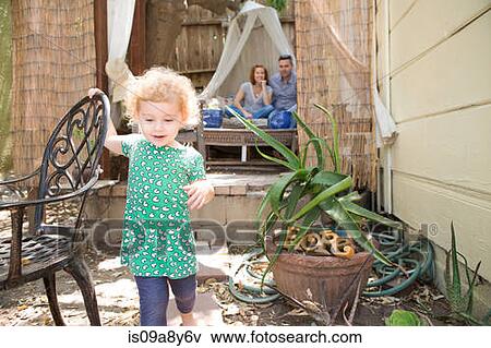 Stock Photo - Child walking away from parents. Fotosearch
