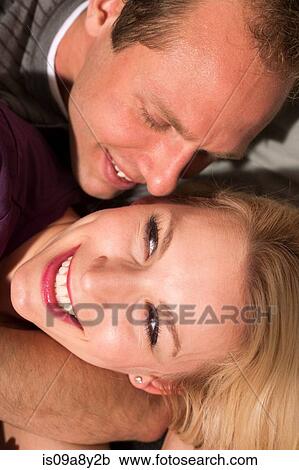 Stock Image - Couple in playful embrace. Fotosearch