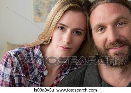 Stock Photograph - Couple looking at camera. Fotosearch