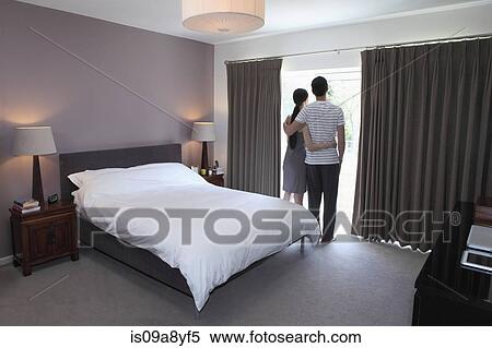 Couple looking through glass door View Large Photo Image Stock Photography - Couple looking through glass door. Fotosearch