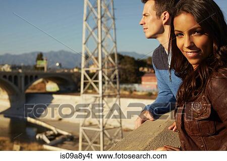 Stock Photograph - Couple on roof top. Fotosearch