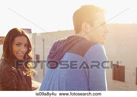 Couple on roof top View Large Photo Image Stock Photograph - Couple on roof top. Fotosearch