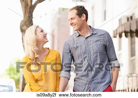 Couple smiling at each other View Large Photo Image Stock Image - Couple smiling at each other. Fotosearch