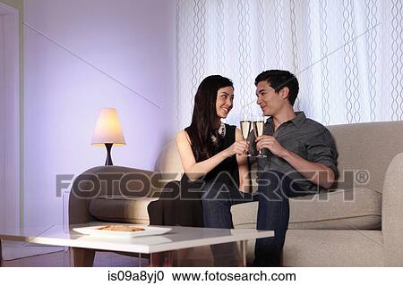 Couple toasting in celebration View Large Photo Image Stock Image - Couple toasting in celebration. Fotosearch