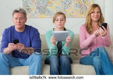 Family with teenage girl using communication devices View Large Photo Image Stock Image - Family with teenage girl using communication devices. Fotosearch