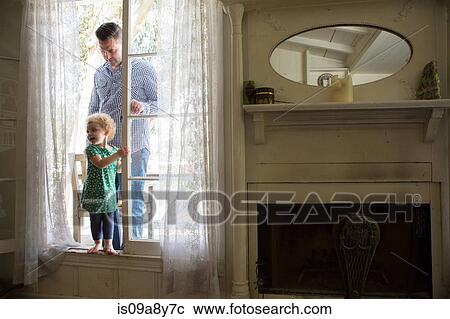 Father and child entering room from verandah View Large Photo Image Stock Image - Father and child entering room from verandah. Fotosearch