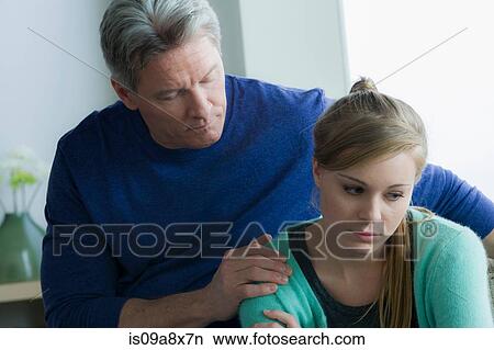 Father comforting teenage daughter View Large Photo Image Picture - Father comforting teenage daughter. Fotosearch