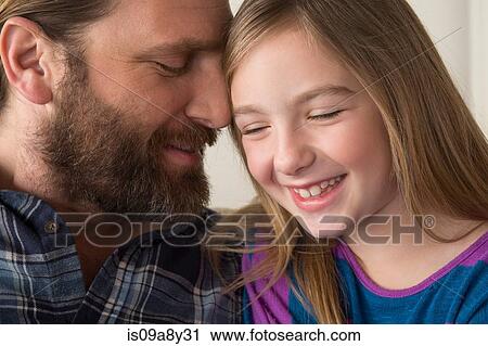 Father leaning face on daughter's head View Large Photo Image Stock Image - Father leaning face on daughter's head. Fotosearch