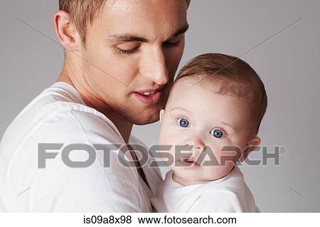 Stock Photo - Father with baby daughter. Fotosearch