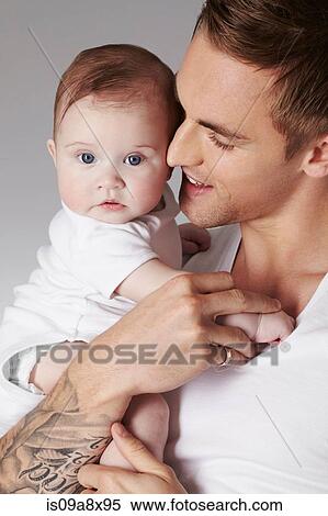 Stock Photography - Father with baby daughter. Fotosearch