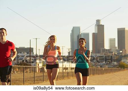 Friends jogging and laughing View Large Photo Image Picture - Friends jogging and laughing. Fotosearch