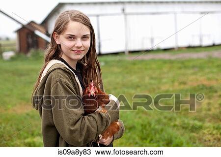 Girl carrying hen View Large Photo Image Stock Image - Girl carrying hen. Fotosearch