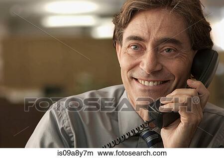 Happy man on telephone View Large Photo Image Picture - Happy man on telephone. Fotosearch