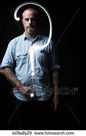 Huge question mark in front of man View Large Photo Image Stock Photo - Huge question mark in front of man. Fotosearch