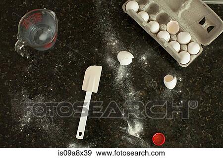 Kitchen counter with egg box, jog and spatula View Large Photo Image Stock Photo - Kitchen counter with egg box, jog and spatula. Fotosearch