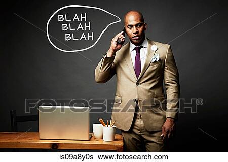 Stock Photograph - Man bored with caller on mobile phone. Fotosearch