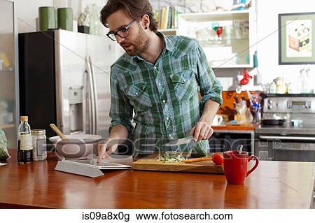 Man chopping vegetables View Large Photo Image Stock Image - Man chopping vegetables. Fotosearch