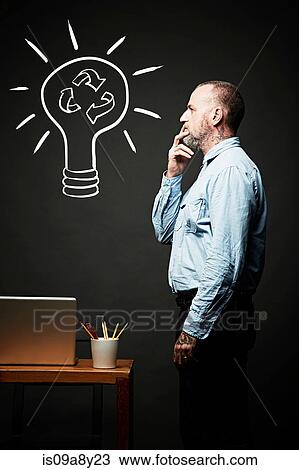 Man contemplating on recycling idea View Large Photo Image Stock Image - Man contemplating on recycling idea. Fotosearch