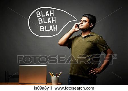 Stock Image - Man listening intently on mobile phone. Fotosearch