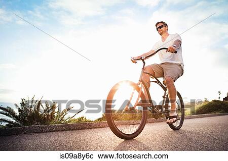 Man on bicycle View Large Photo Image Stock Image - Man on bicycle. Fotosearch