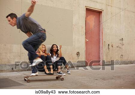 Man showing off skating moves View Large Photo Image Stock Image - Man showing off skating moves. Fotosearch