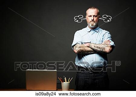 Man with arms crossed fuming in silence View Large Photo Image Picture - Man with arms crossed fuming in silence. Fotosearch