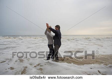 Mature couple dancing on beach View Large Photo Image Stock Photography - Mature couple dancing on beach. Fotosearch