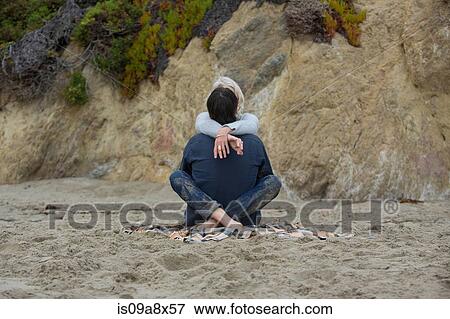 Mature couple sitting on beach cross legged, rear view View Large Photo Image Stock Photo - Mature couple sitting on beach cross legged, rear view. Fotosearch