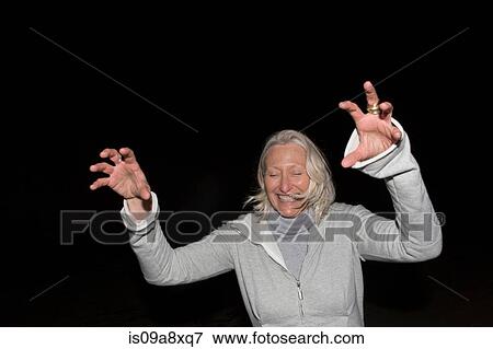 Stock Photo - Mature woman pretending to be monster. Fotosearch
