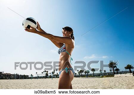 Mature woman serving in beach volleyball View Large Photo Image Stock Photography - Mature woman serving in beach volleyball. Fotosearch