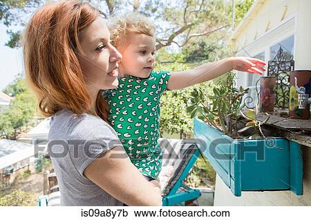 Stock Image - Mother and child exploring. Fotosearch