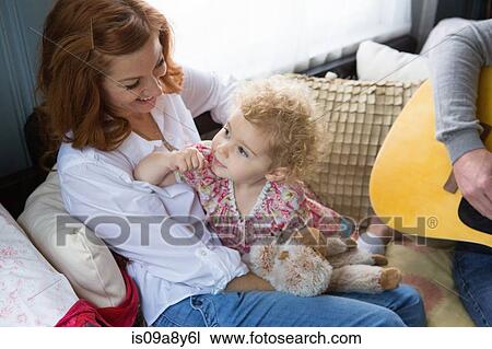 Stock Image - Mother smiling at child. Fotosearch
