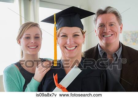 Mother wearing mortarboard with daughter and husband View Large Photo Image Stock Photo - Mother wearing mortarboard with daughter and husband. Fotosearch