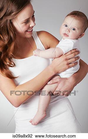 Mother with baby daughter View Large Photo Image Stock Image - Mother with baby daughter. Fotosearch