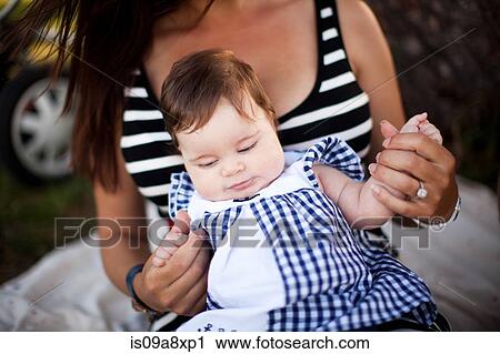 Stock Image - Mother with baby daughter. Fotosearch