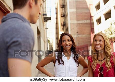 People chatting in back lane View Large Photo Image Stock Photo - People chatting in back lane. Fotosearch
