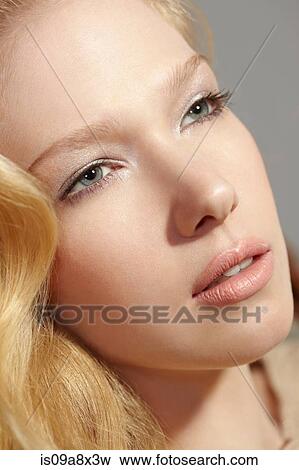 Stock Photo - Portrait of blonde woman looking away. Fotosearch