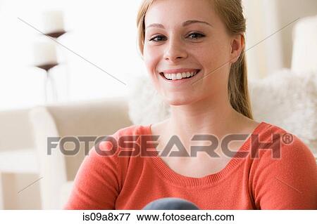 Stock Photo - Portrait of confident teenage girl smiling. Fotosearch
