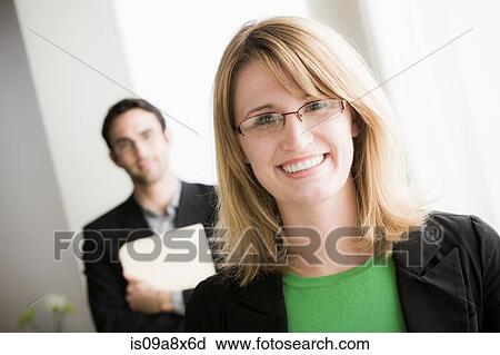 Portrait of female office worker wearing glasses View Large Photo Image Stock Image - Portrait of female office worker wearing glasses. Fotosearch