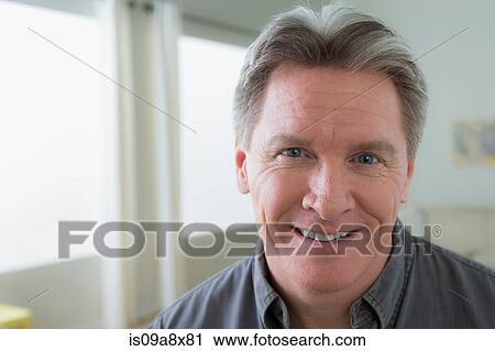 Stock Image - Portrait of mature man smiling. Fotosearch