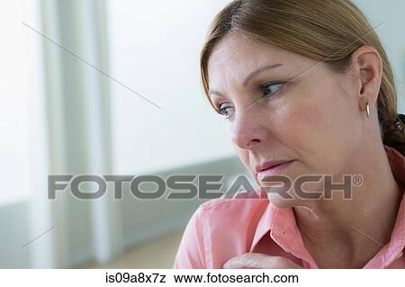 Portrait of sad mature woman looking away View Large Photo Image Stock Photo - Portrait of sad mature woman looking away. Fotosearch