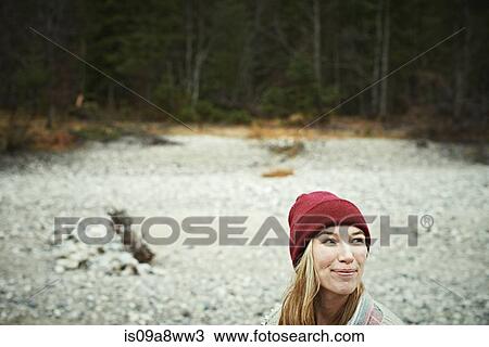 Stock Image - Portrait of woman in remote setting. Fotosearch