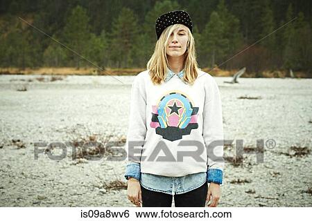 Stock Photograph - Portrait of woman wearing cap headwear. Fotosearch