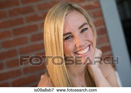 Portrait of young blonde woman smiling View Large Photo Image Stock Photo - Portrait of young blonde woman smiling. Fotosearch