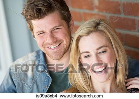 Picture - Portrait of young couple smiling. Fotosearch