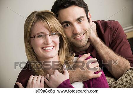 Portrait of young couple smiling View Large Photo Image Stock Image - Portrait of young couple smiling. Fotosearch