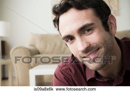 Portrait of young man with black hair, smiling View Large Photo Image Stock Image - Portrait of young man with black hair, smiling. Fotosearch