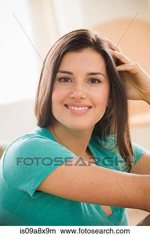 Picture - Portrait of young woman smiling towards camera. Fotosearch
