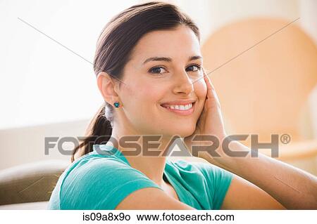 Picture - Portrait of young woman smiling towards camera. Fotosearch