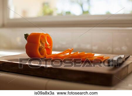 Red pepper slices on chopping board View Large Photo Image Stock Image - Red pepper slices on chopping board. Fotosearch
